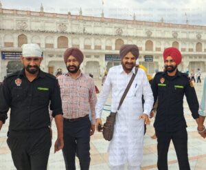 Balkaur Singh with security in Golden Temple